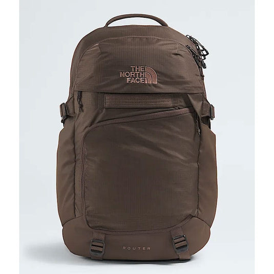 Brown backpack with The North Face logo on a light gray background