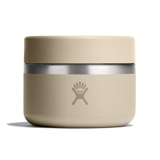 Beige thermos with silver base on a white background