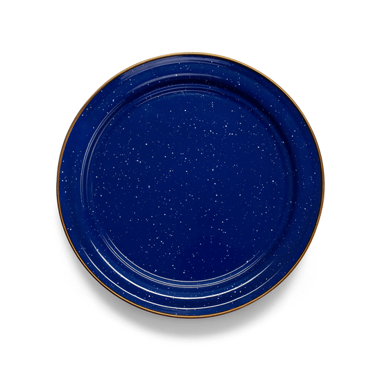 Blue ceramic plate with gold rim on a white background
