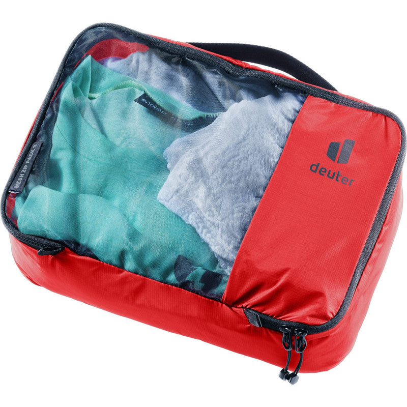Load image into Gallery viewer, Red packing cube with clothes inside on a white background
