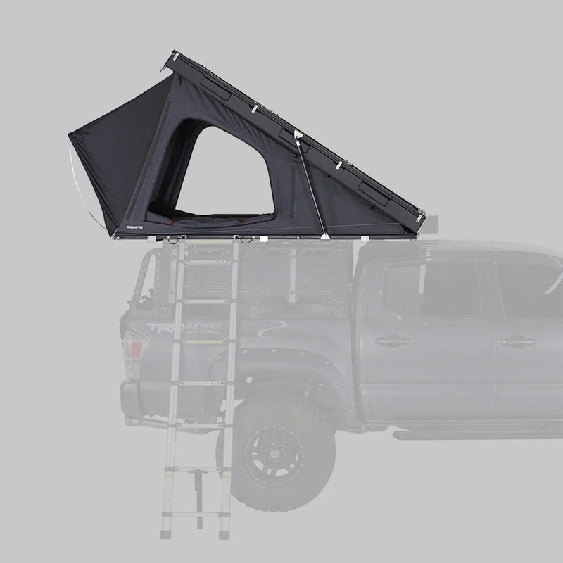 Load image into Gallery viewer, Black rooftop tent attached to a vehicle on a gray background
