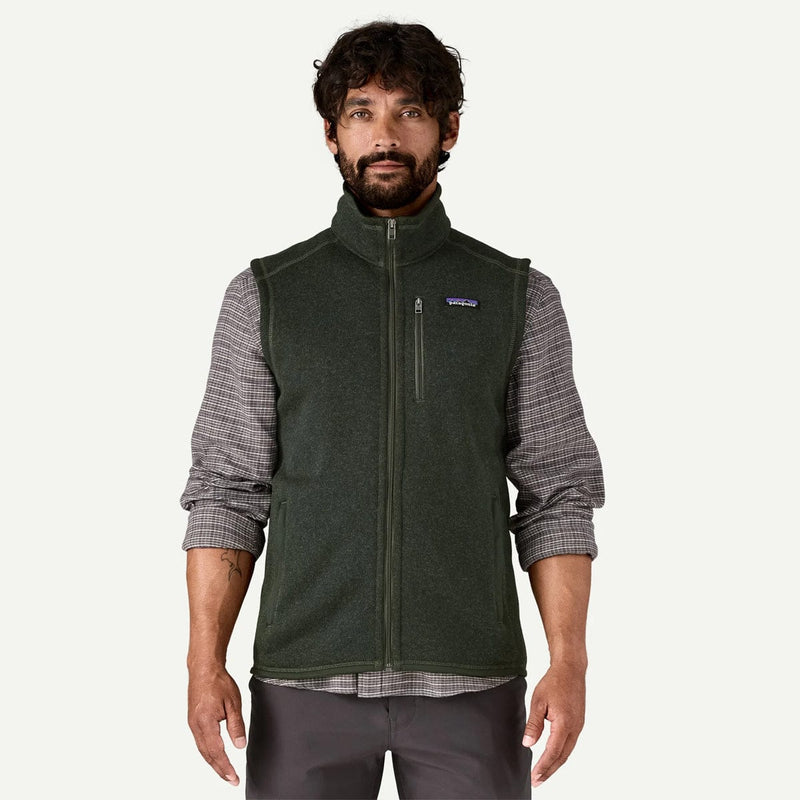 Load image into Gallery viewer, Man wearing a green fleece vest over a plaid shirt on a white background
