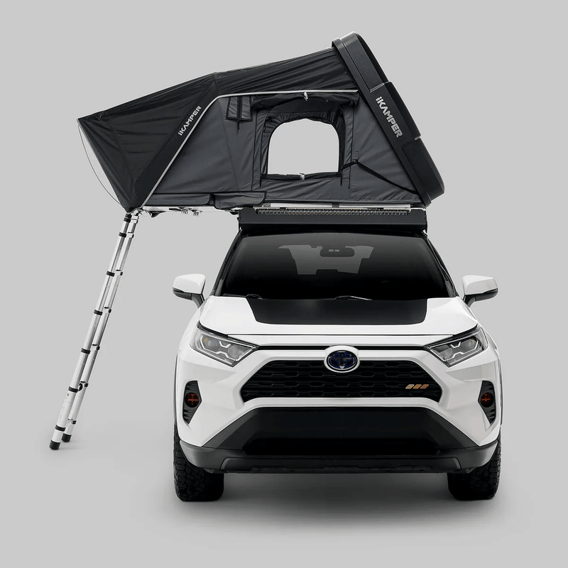 Load image into Gallery viewer, White SUV with a black rooftop tent on a gray background
