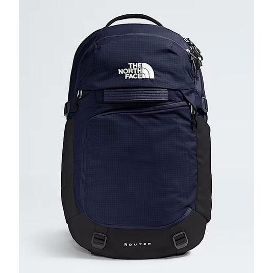 Navy blue backpack with The North Face logo on a light gray background