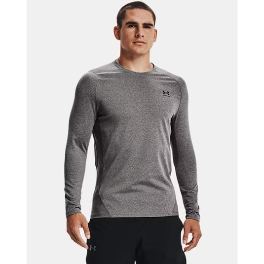Man wearing a gray long-sleeve athletic shirt with a brand logo on a white background