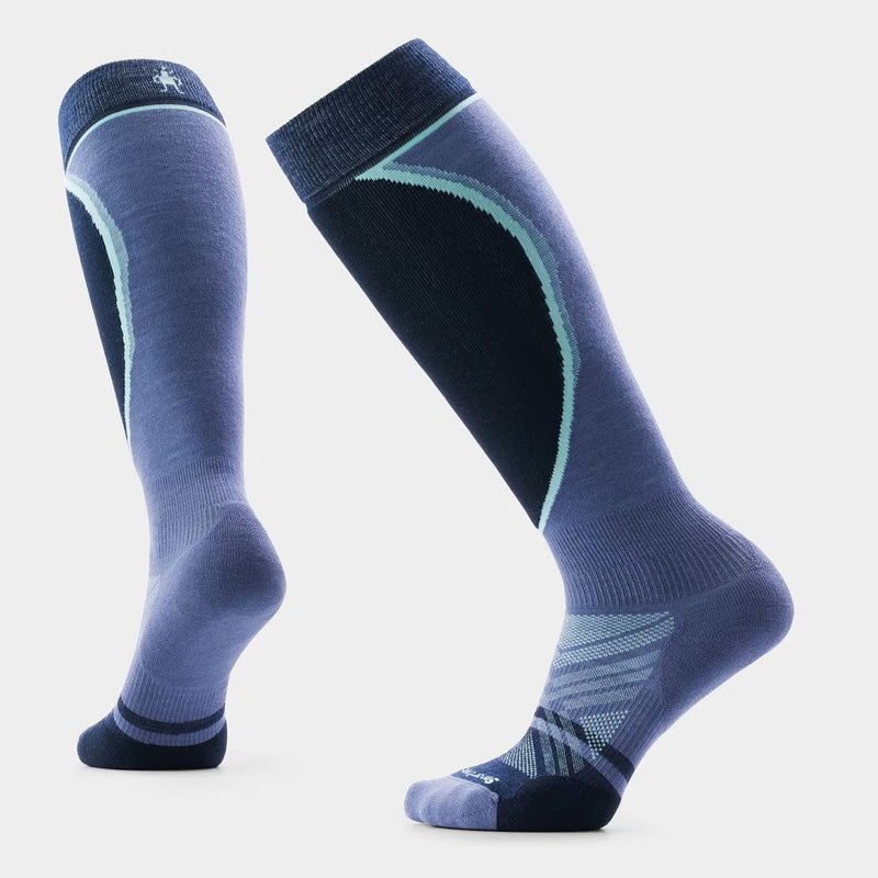 Load image into Gallery viewer, Pair of blue knee-high socks with a subtle pattern on a light gray background
