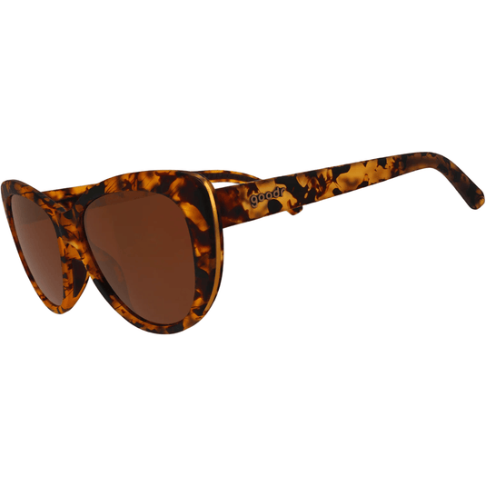 Tortoiseshell sunglasses with brown lenses on a white background
