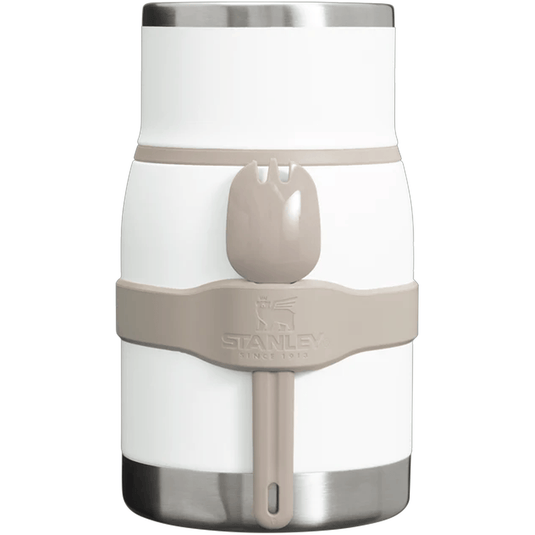White and beige Stanley insulated mug with handle on a white background