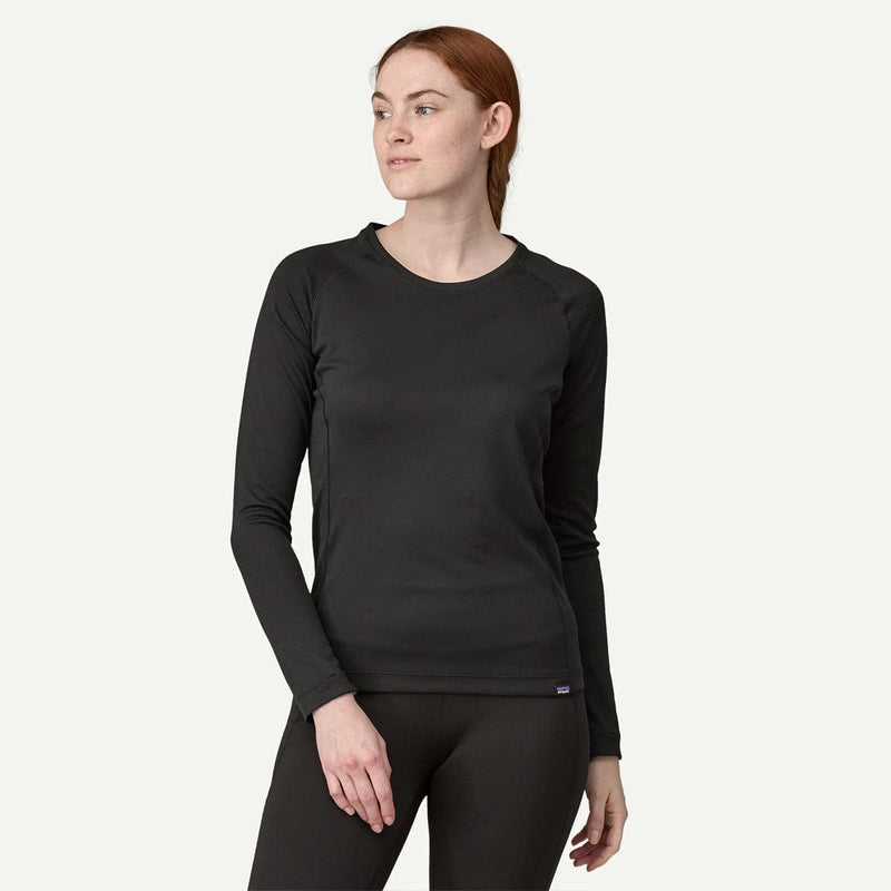 Load image into Gallery viewer, Woman wearing a black long-sleeve top and pants on a white background
