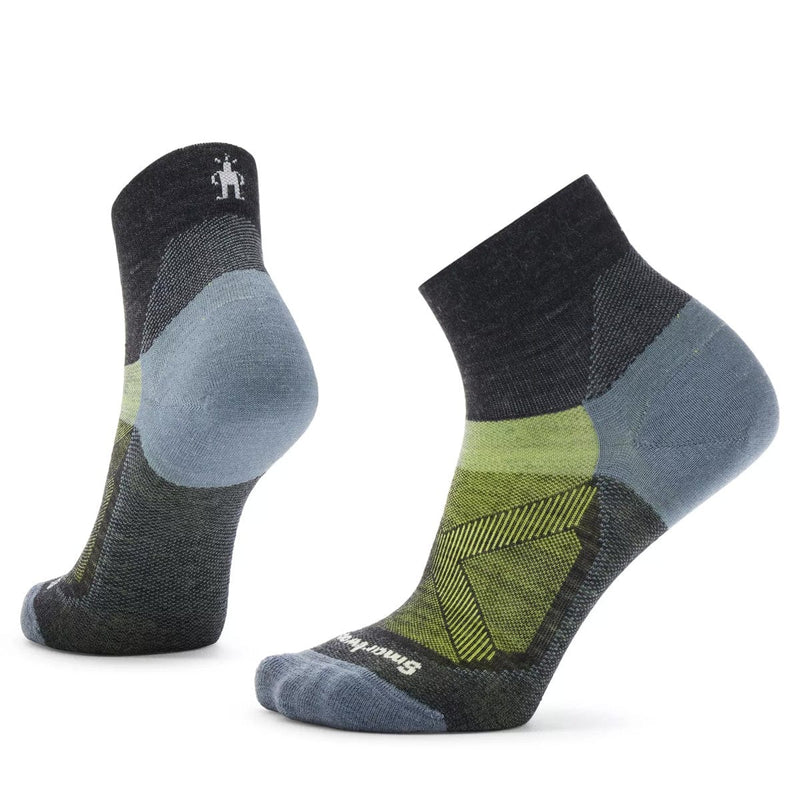 Load image into Gallery viewer, A pair of Smartwool women's bike zero cushion ankle socks in gray, green, and blue colors.
