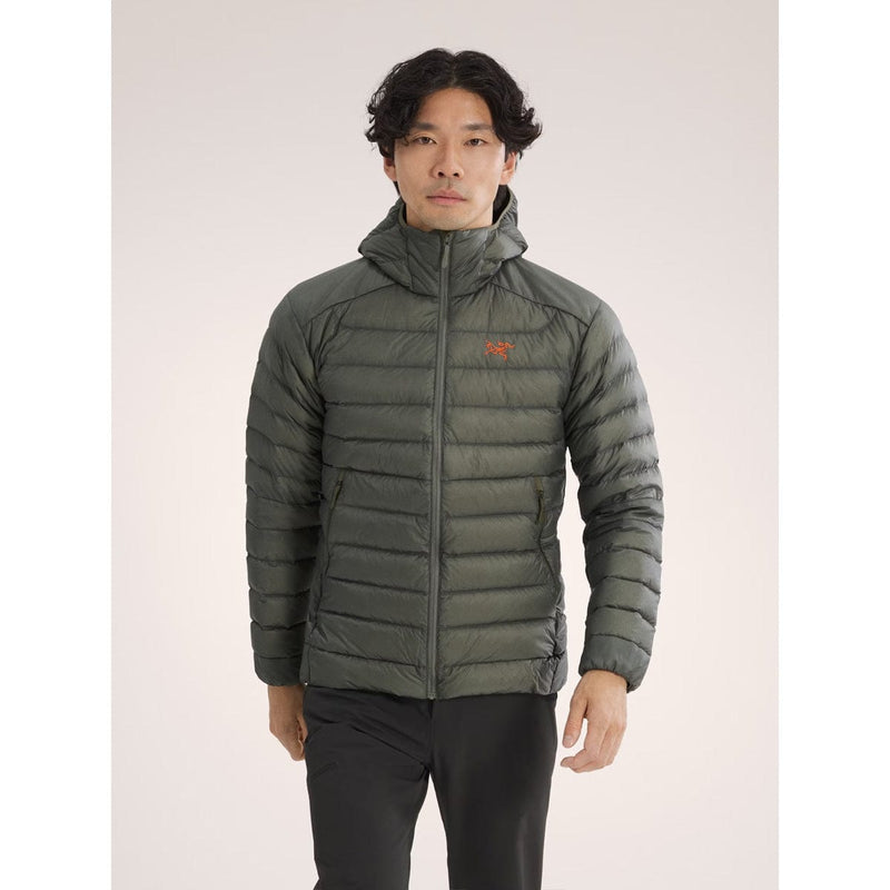 Load image into Gallery viewer, Person wearing a green puffer jacket on a light gray background
