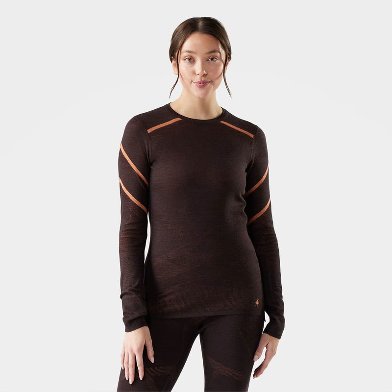 Load image into Gallery viewer, Woman wearing a brown long-sleeve athletic shirt with orange accents on a white background
