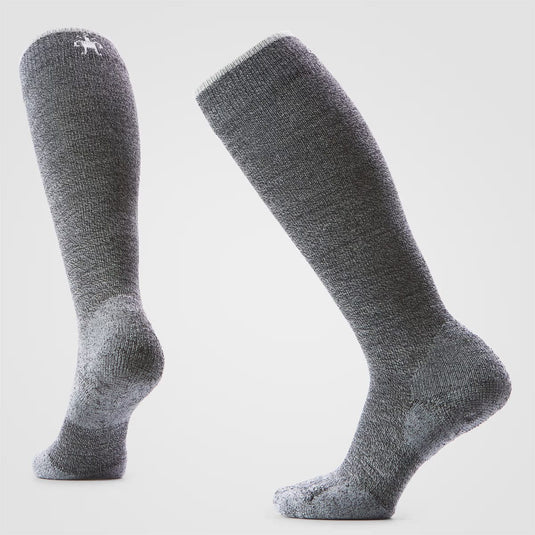 Pair of gray knee-high socks on a light gray background