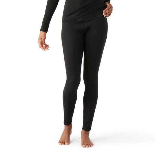 Person wearing black leggings on a white background