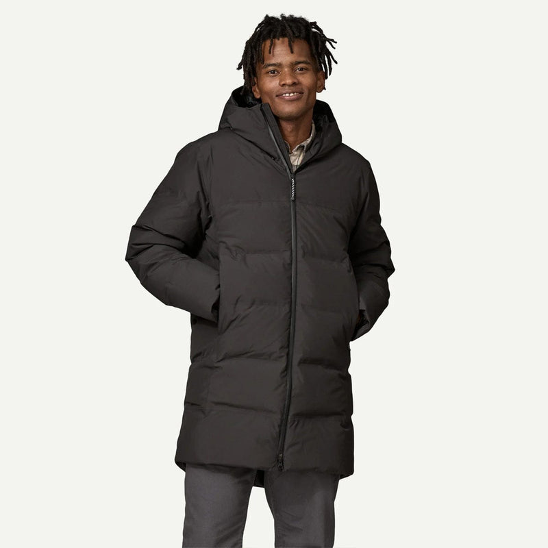 Load image into Gallery viewer, Man wearing a black puffer jacket on a white background
