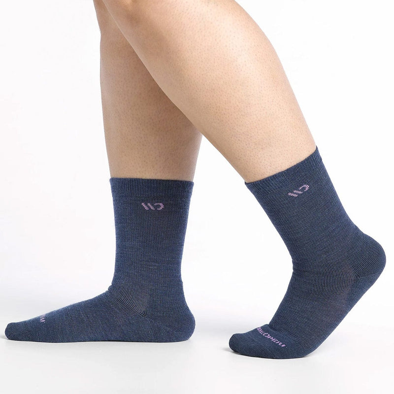 Load image into Gallery viewer, Blue socks worn by a person on a white background
