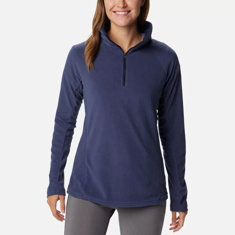 Load image into Gallery viewer, A woman wearing a navy blue Columbia Glacial IV half zip fleece pullover with long sleeves.
