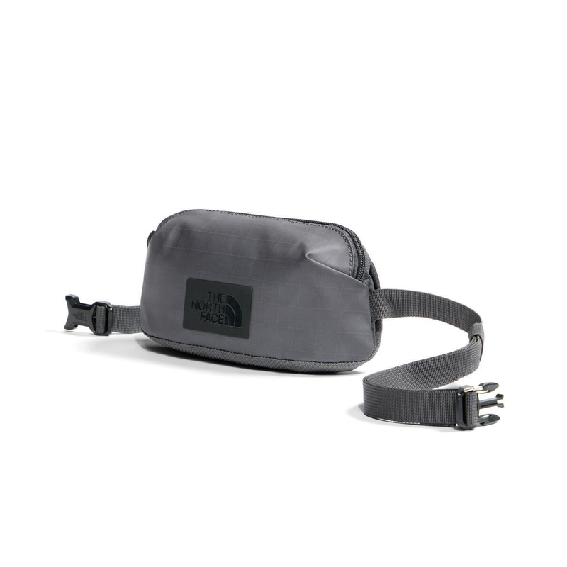 Load image into Gallery viewer, Gray waist bag with The North Face logo on a white background
