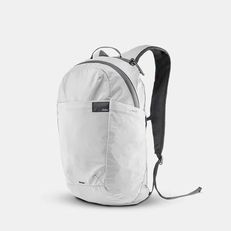 Load image into Gallery viewer, Light gray backpack on a white background
