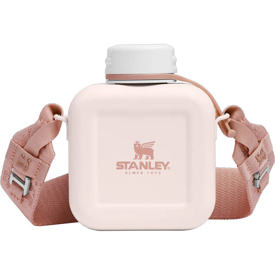 Pink water bottle with strap featuring Stanley logo on a white background