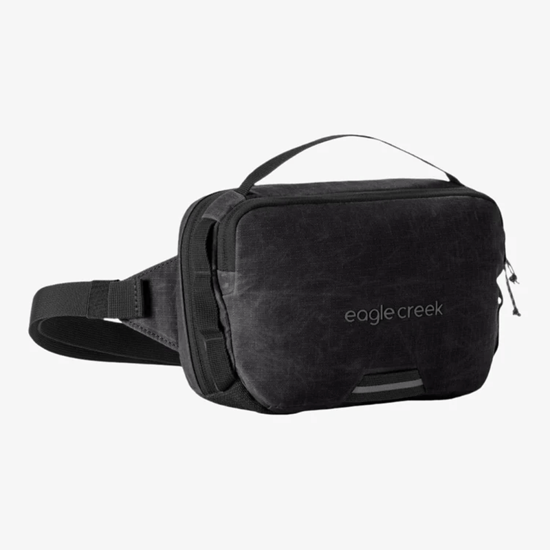 Load image into Gallery viewer, Black waist bag with 'eagle creek' branding on a white background
