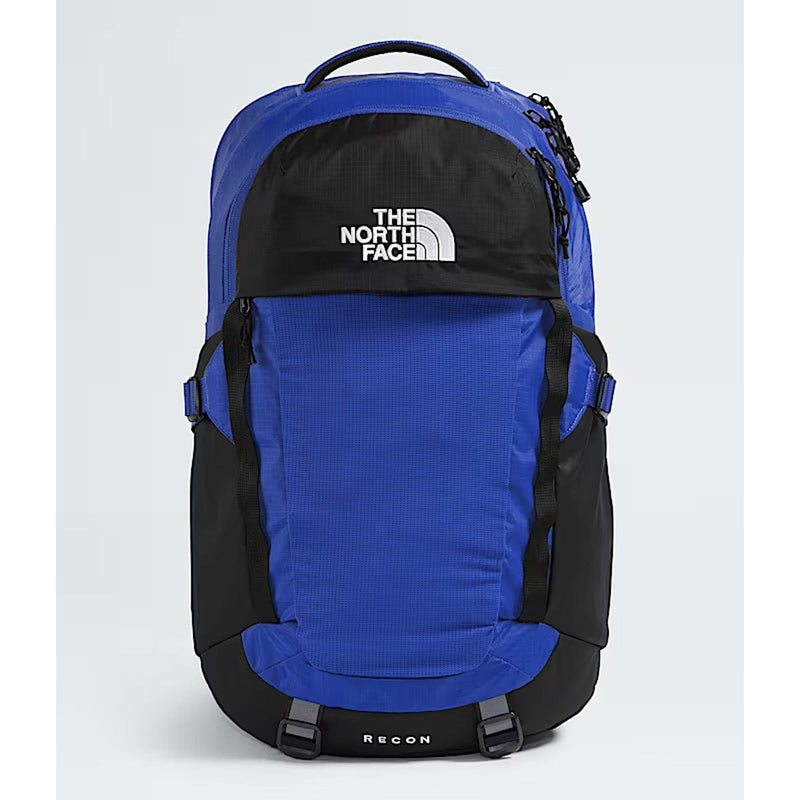 Load image into Gallery viewer, Blue and black The North Face backpack on a light gray background

