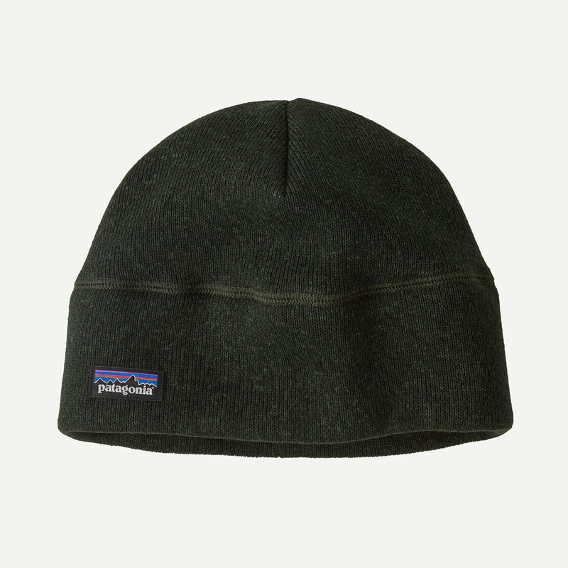 Load image into Gallery viewer, Black beanie with Patagonia logo on a light gray background
