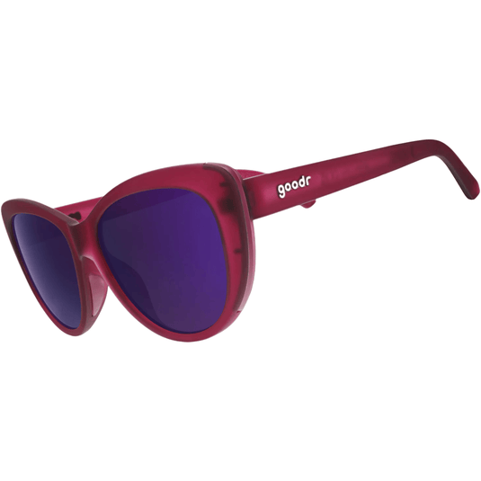 Red sunglasses with purple lenses on a white background
