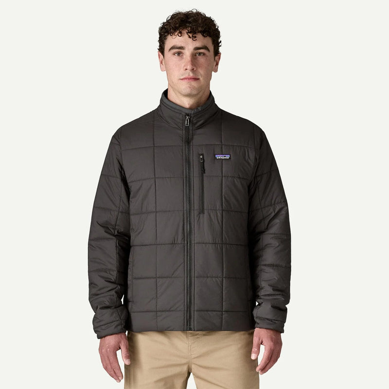 Load image into Gallery viewer, Man wearing a dark gray quilted jacket with a visible brand logo on a white background
