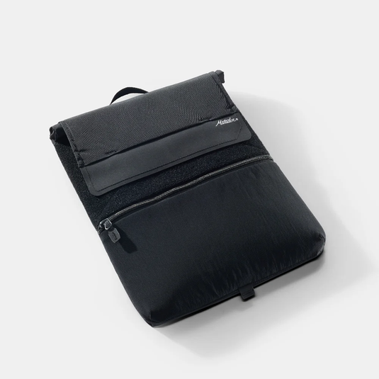 Black backpack with a visible brand logo on a white background