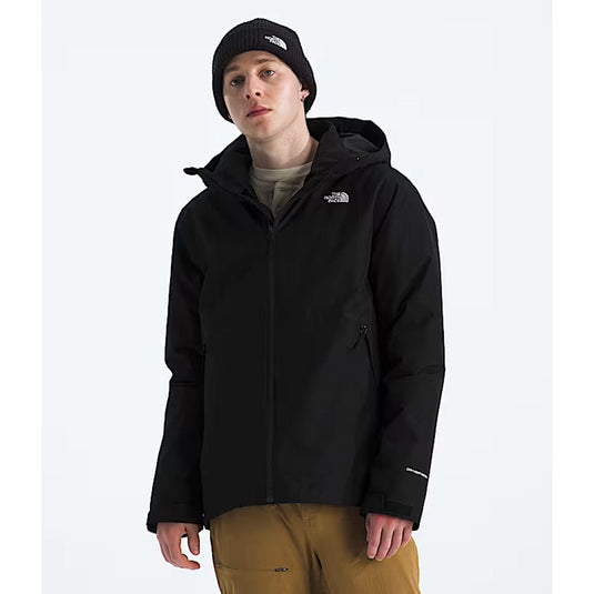 Person wearing a black jacket with a brand logo on a white background
