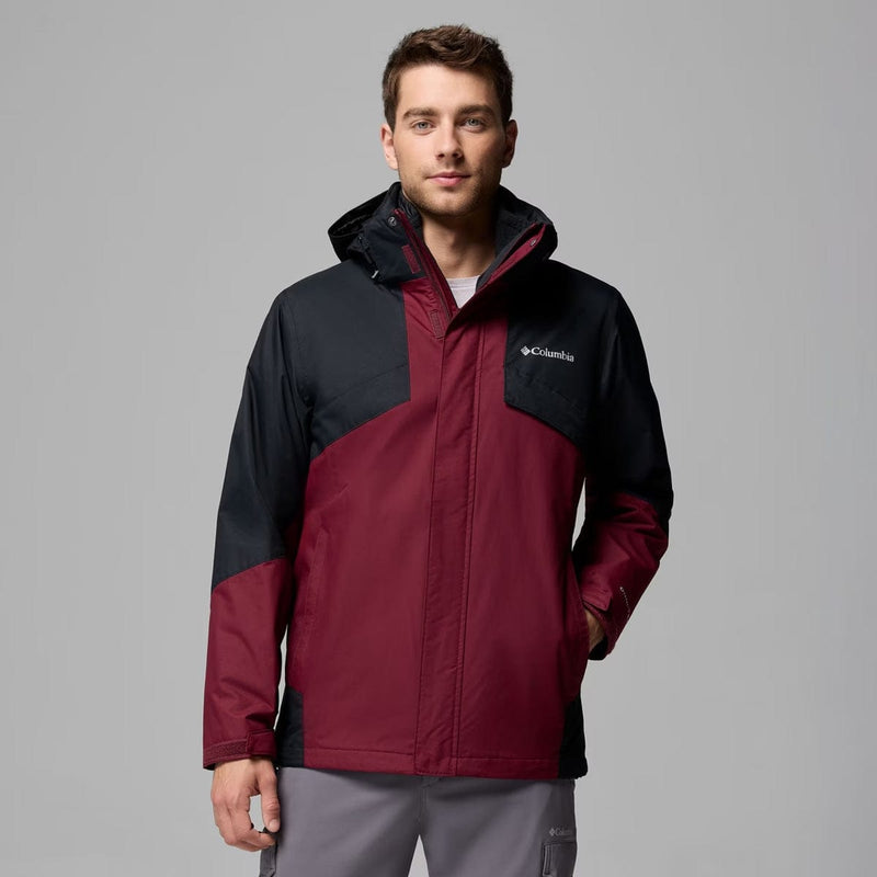 Load image into Gallery viewer, Man wearing a red and black Columbia jacket on a gray background

