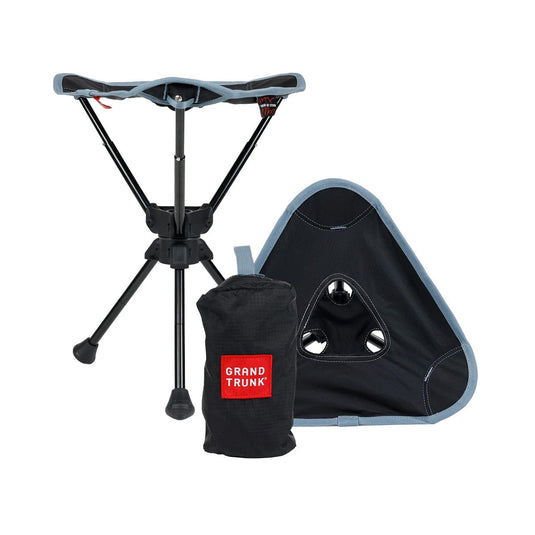 Portable stool with carrying bag and pouch on a white background, featuring 'Grand Trunk' branding.