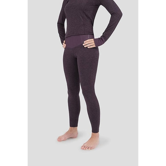 Person wearing a dark purple long-sleeve top and leggings on a white background