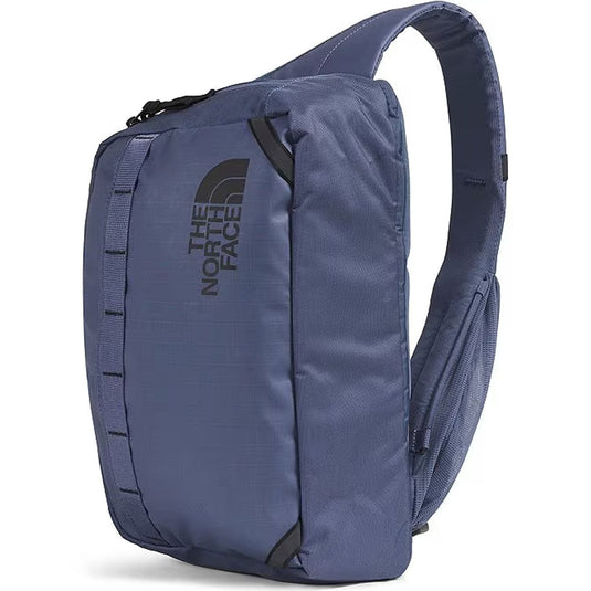 Blue sling bag with The North Face logo on a white background