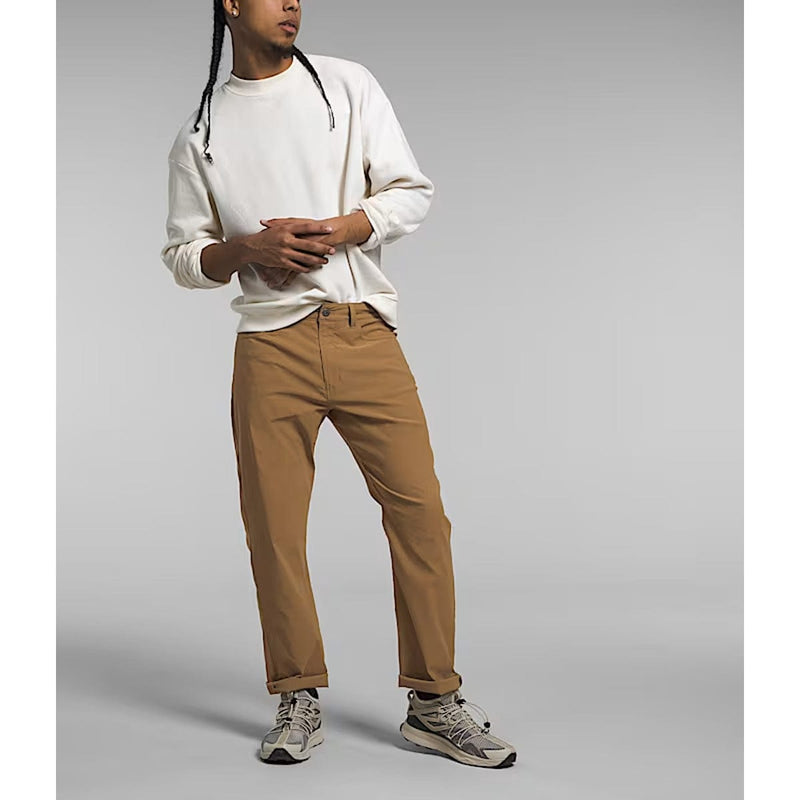 Load image into Gallery viewer, Person wearing a white long-sleeve shirt and brown pants on a gray background
