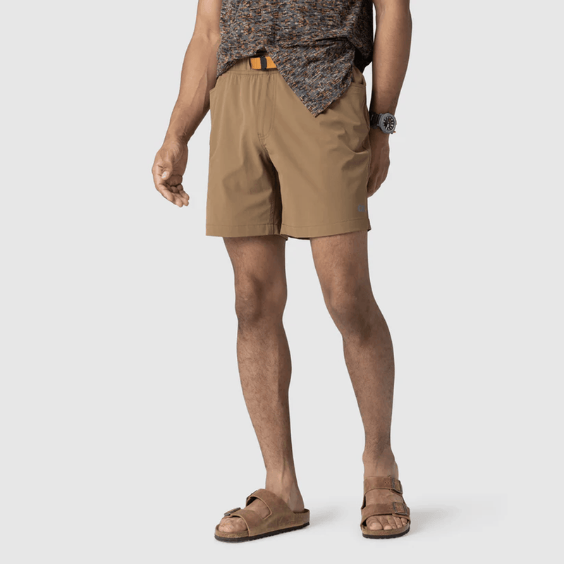 Load image into Gallery viewer, Person wearing beige shorts on a plain background
