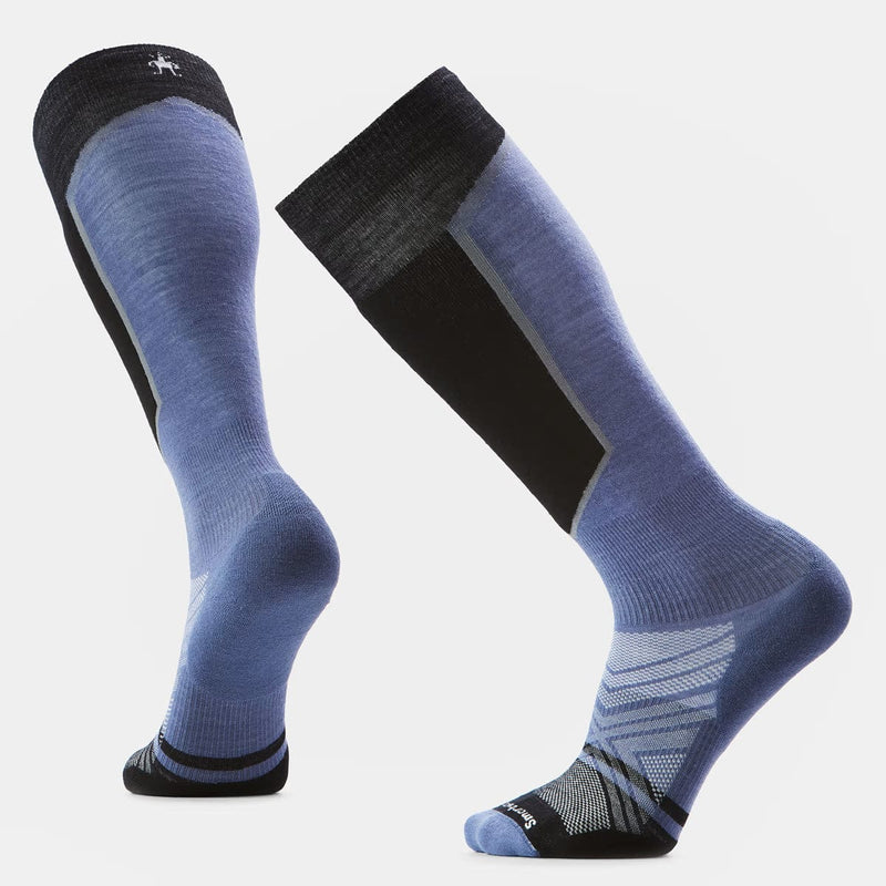 Load image into Gallery viewer, Pair of blue knee-high socks with black accents on a light gray background
