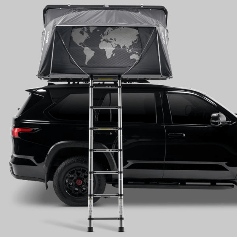 Load image into Gallery viewer, Roof top tent with ladder on a black SUV against a gray background
