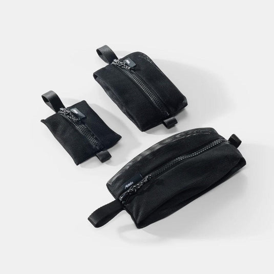 Three black mesh pouches with zippers on a white background