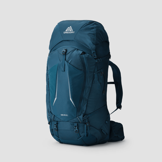 Blue hiking backpack with Gregory logo on a light gray background