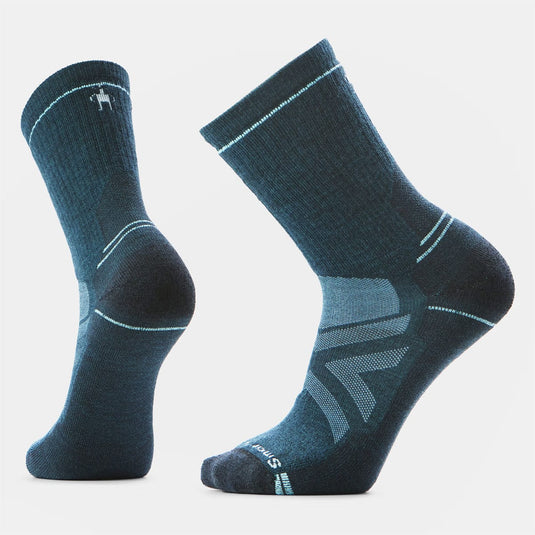 Pair of blue socks with a visible brand logo on a light gray background