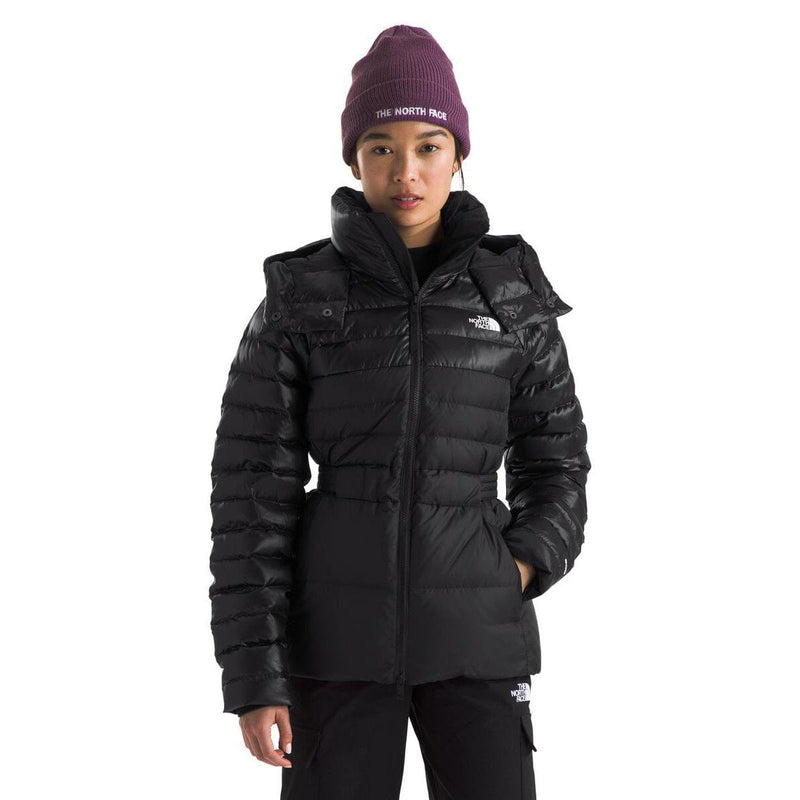 Load image into Gallery viewer, Person wearing a black jacket and purple beanie with 'The North Face' logo on a white background

