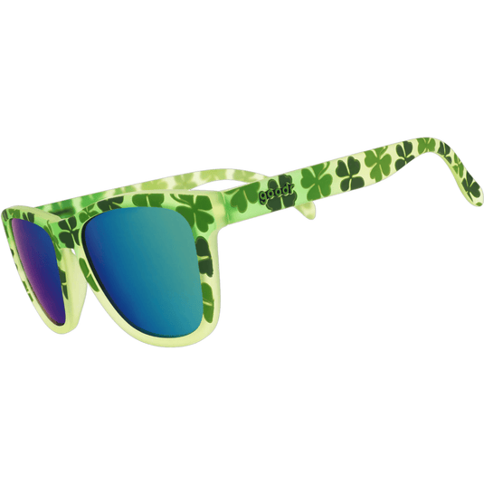 Sunglasses with green frame and blue lenses on a white background
