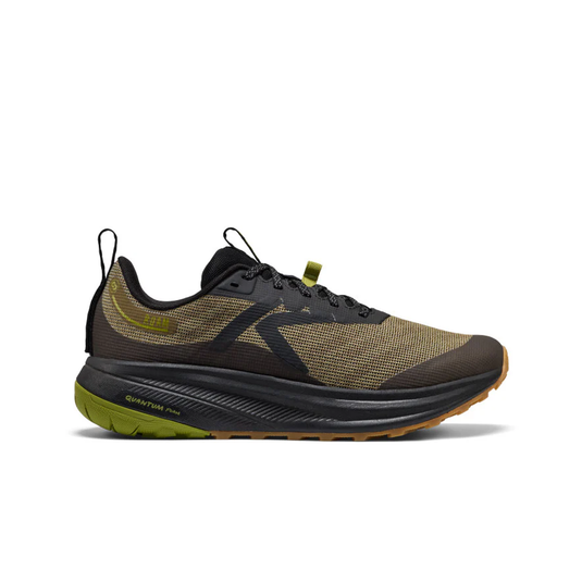 Black and green running shoe on a white background