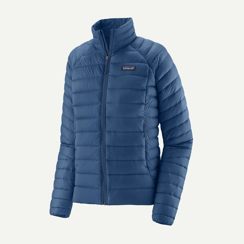 Load image into Gallery viewer, Blue puffer jacket with a brand logo on a light gray background
