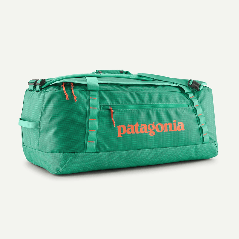 Load image into Gallery viewer, Green duffel bag with Patagonia logo on a white background
