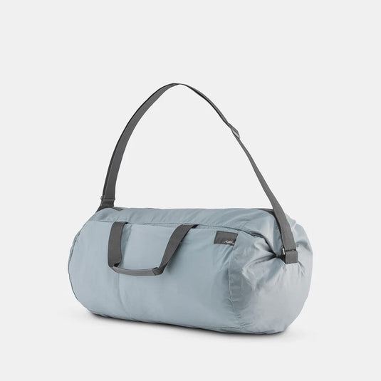 Light blue duffel bag with gray straps on a white background
