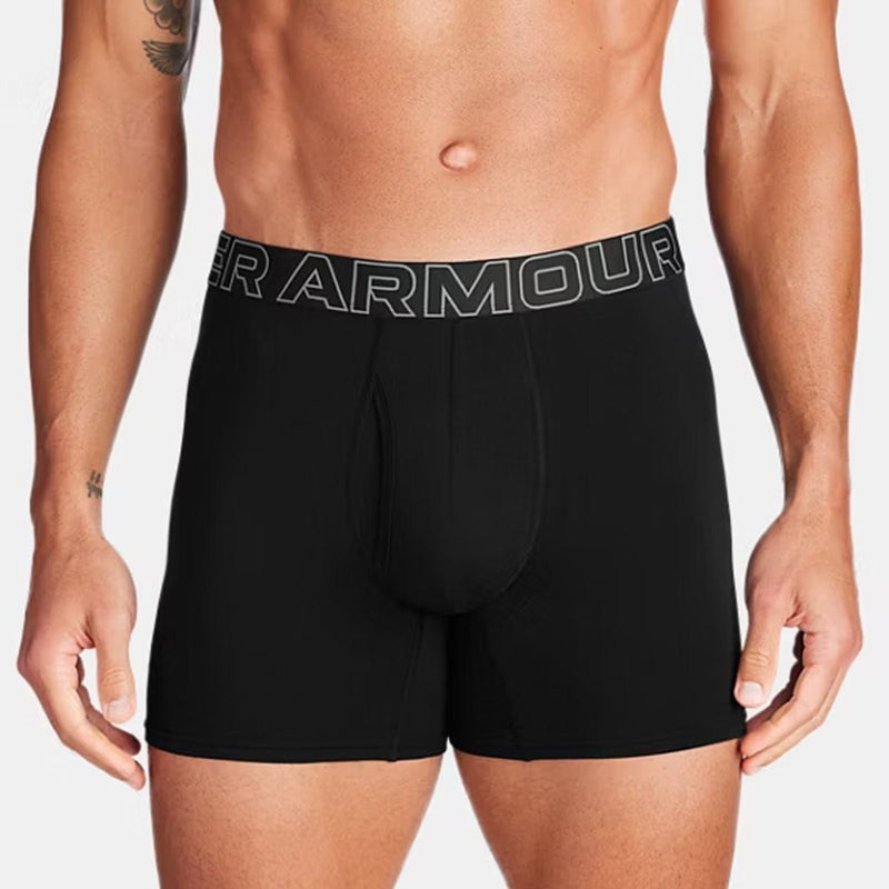 Load image into Gallery viewer, Black Under Armour boxer briefs worn by a person on a plain background
