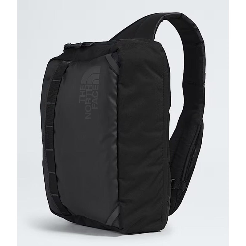 Load image into Gallery viewer, Black sling bag with The North Face logo on a light gray background
